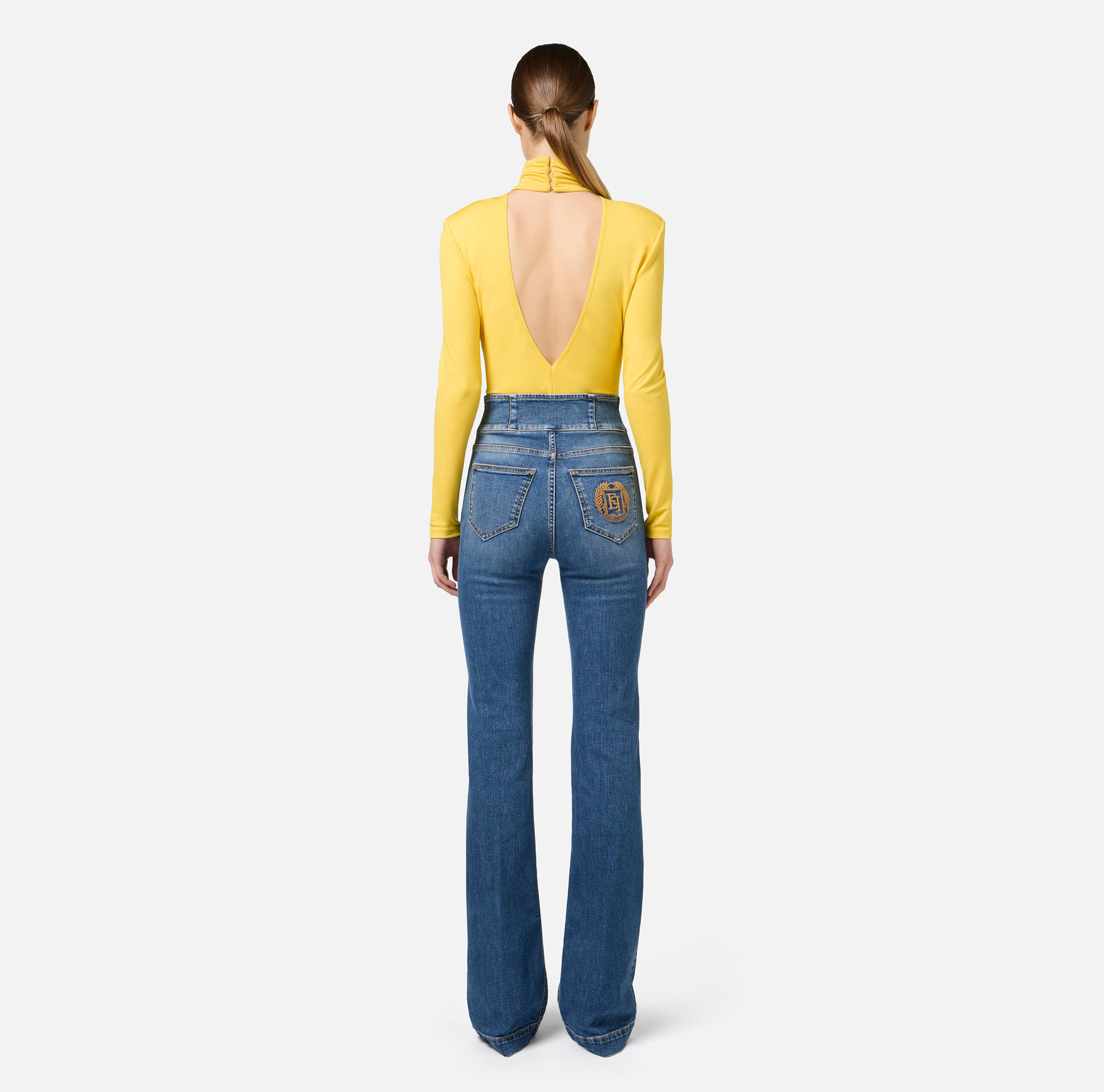 Bell-bottom stretch cotton jeans with central button placket | Elisabetta Franchi® Outlet